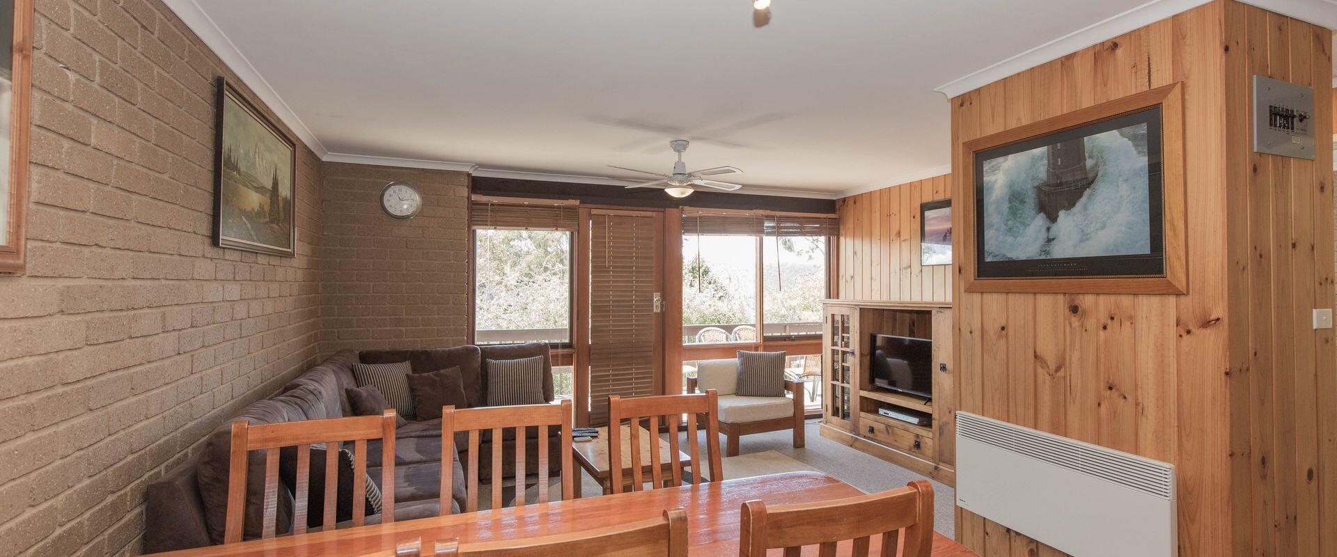 Comfortable upstairs two bedroom apartment with sunny balcony overlooking town and lake. Sleeps five with 1 x double, 1 x bunk & 1 x single bed. New kitchen & facilities.