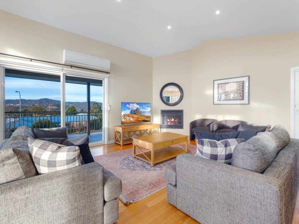 Continuing the social focus of the house upstairs, the open kitchen, living and dining space has an open and airy feel. There are two shared bathrooms as well as two bedrooms with ensuites.