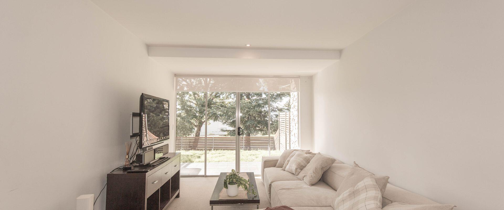 There is a comfortable fold-out double sofa bed in the open-plan dining, kitchen, and living area.